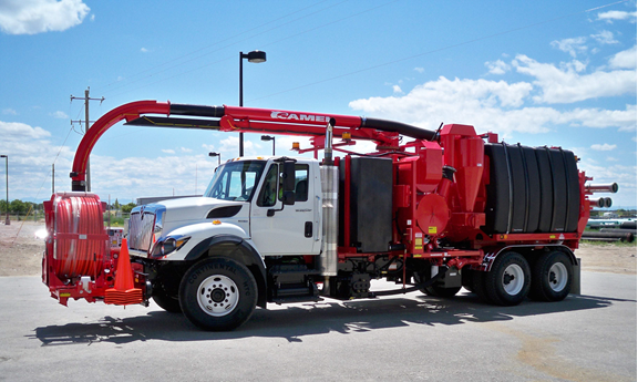 Red and white vactor truck